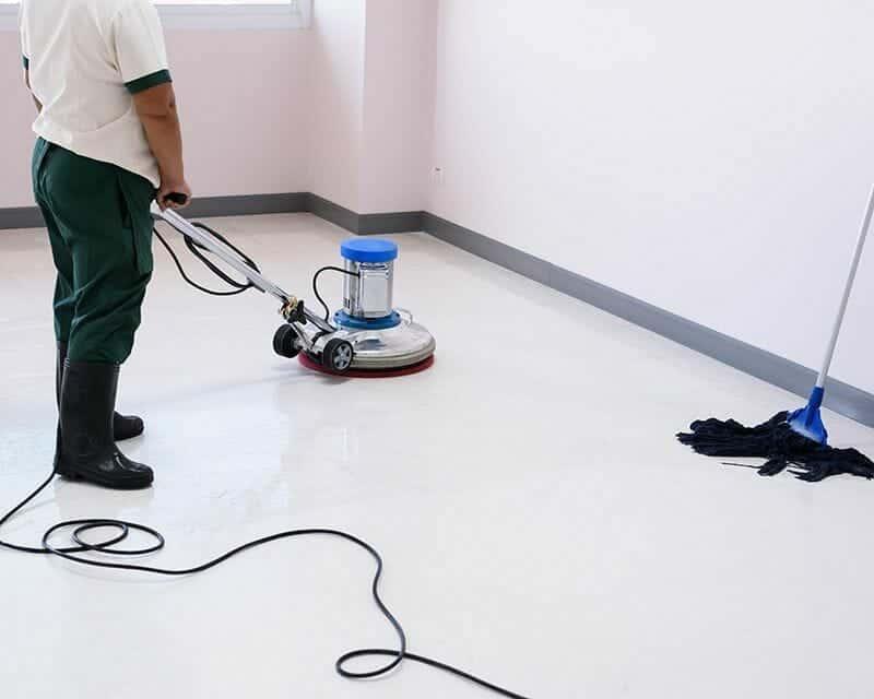 Commercial vinyl floor being machine cleaned and restored in Denver
