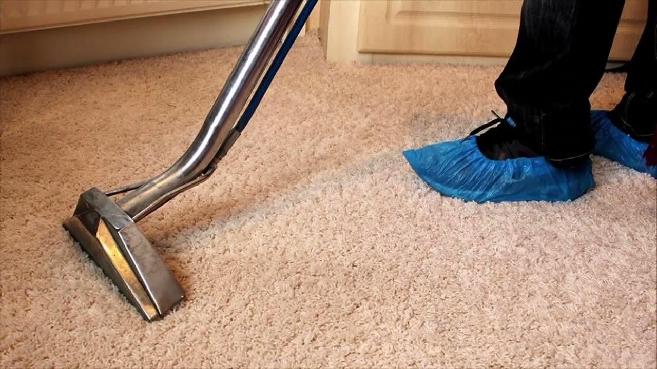 Carpet cleaning technician working in a Denver building