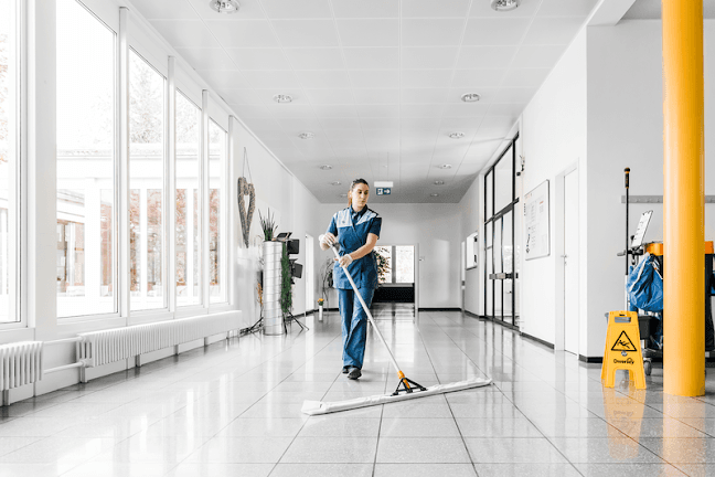 Royal Clean Solutions team cleaning a commercial facility lobby in Denver