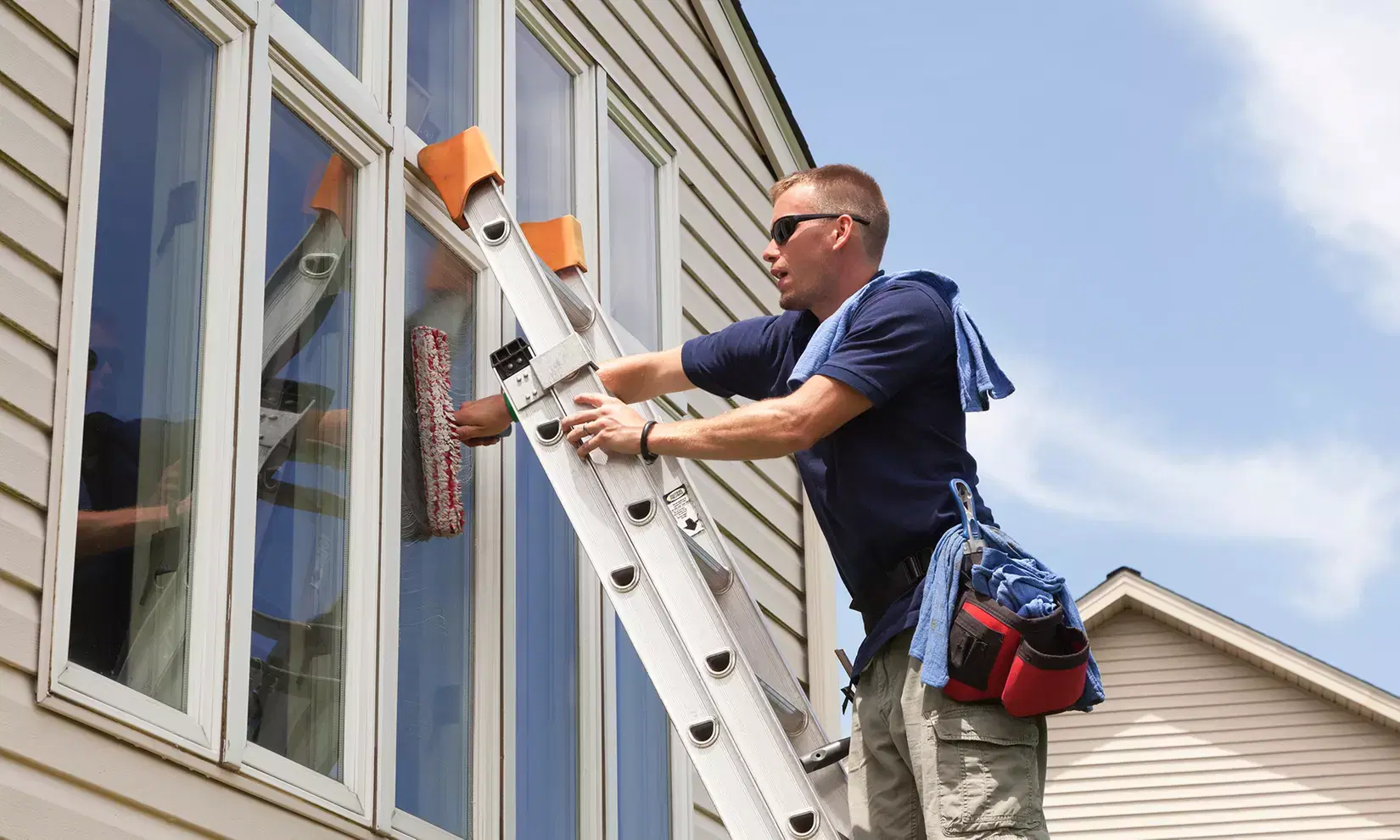 Window cleaners working on a Denver commercial property